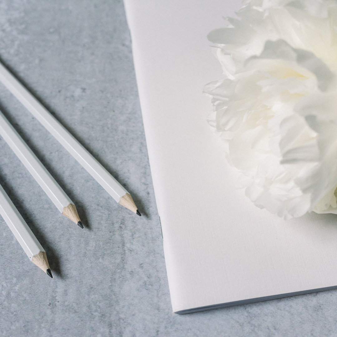 White Notebook with pens