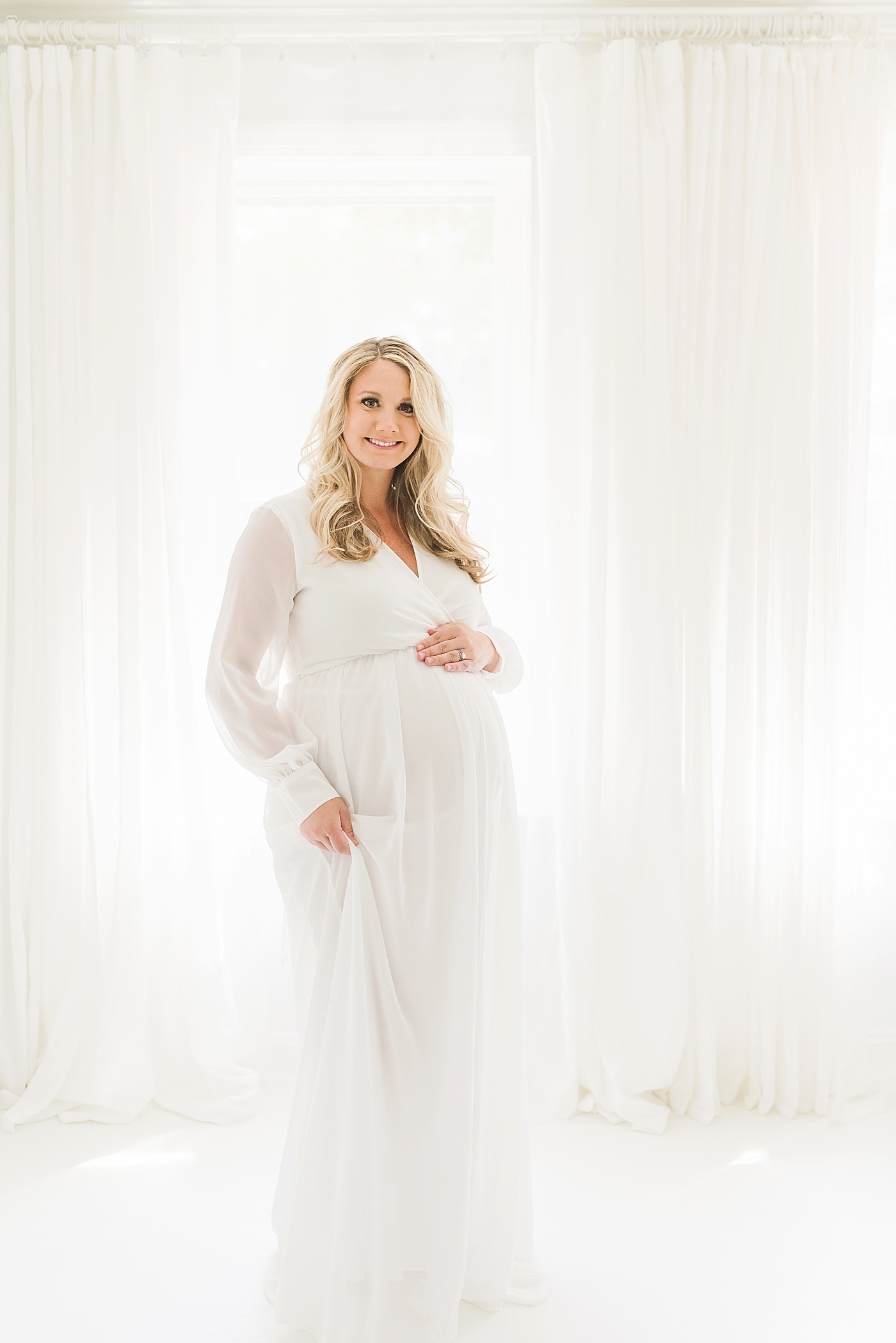 Mom to be in sheer white dress | Photo by Huntersville Newborn Photographer Anna Wisjo 