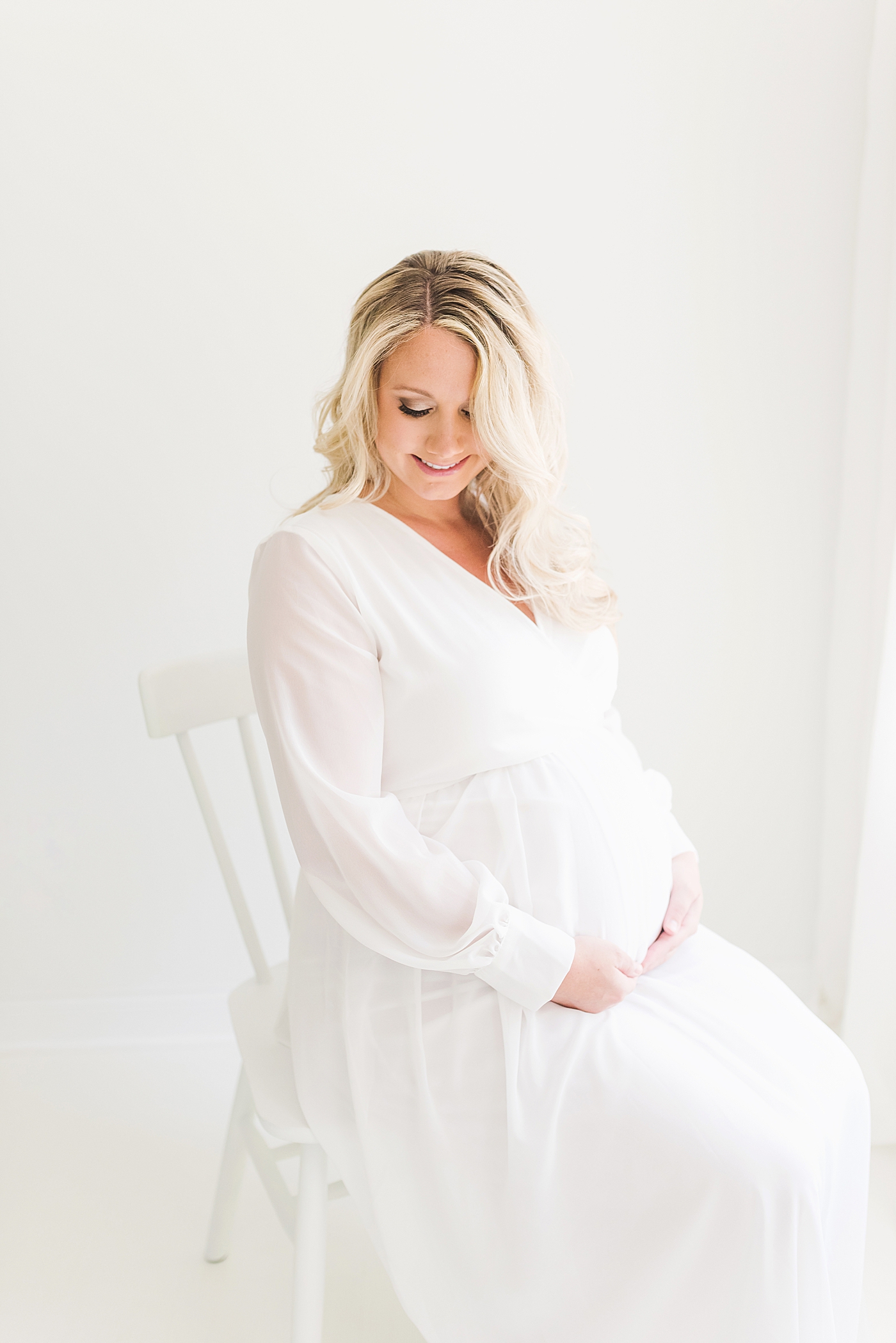 Mama to be in sheer white dress | Photo by Anna Wisjo Photography