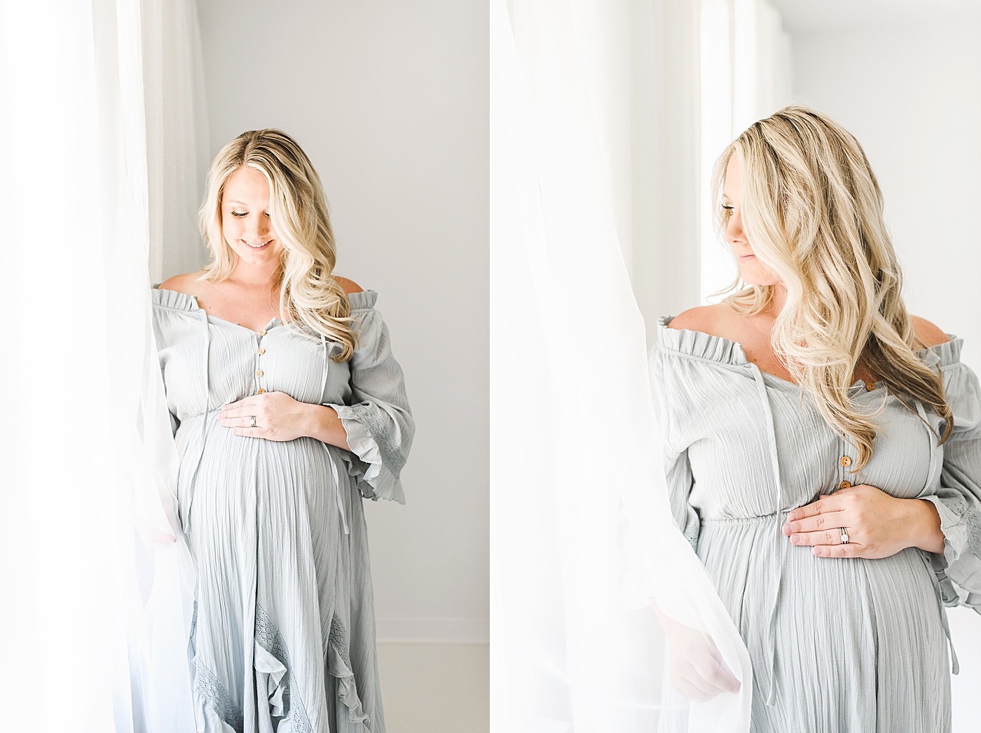 Mother to be in blue dress looking down at belly | Photo by Anna Wisjo Photography