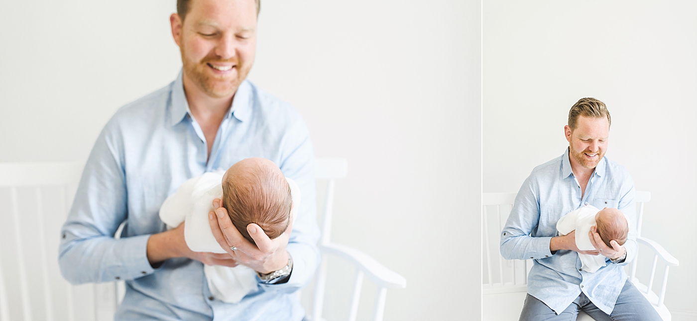Close up of newborn baby boy held by dad | Photo by Anna Wisjo Photography