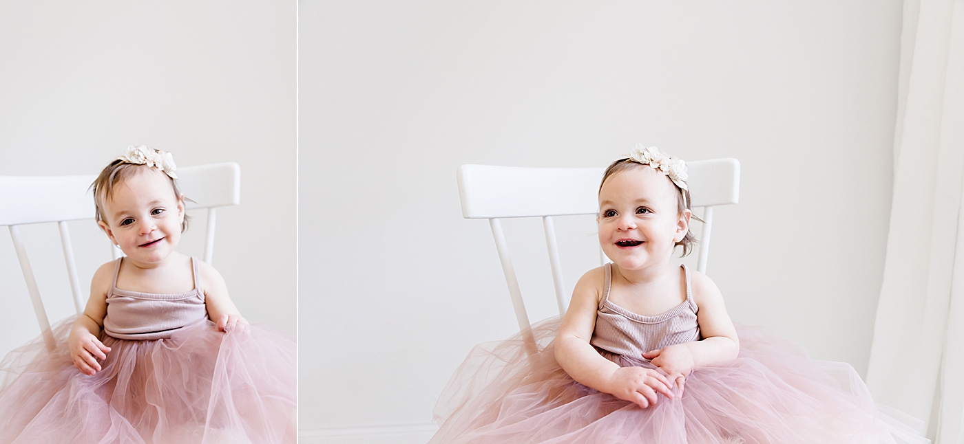 Toddler girl in pink tutu sitting in white chair | Photo by Anna Wisjo Photography