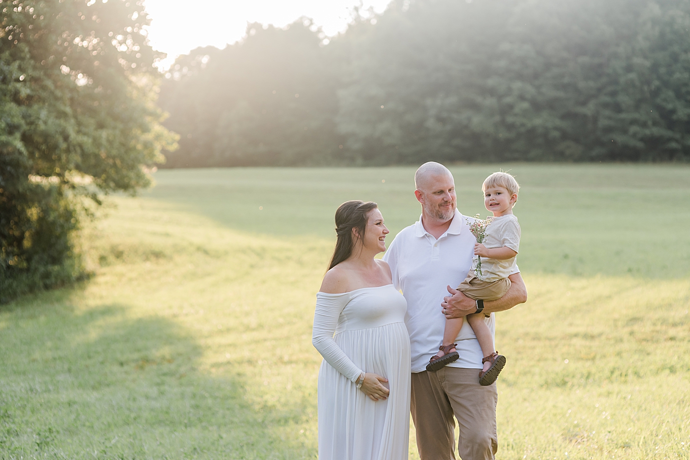Mom, dad, and little boy interacting | Photo by Denver NC Maternity Photographer Anna Wisjo
