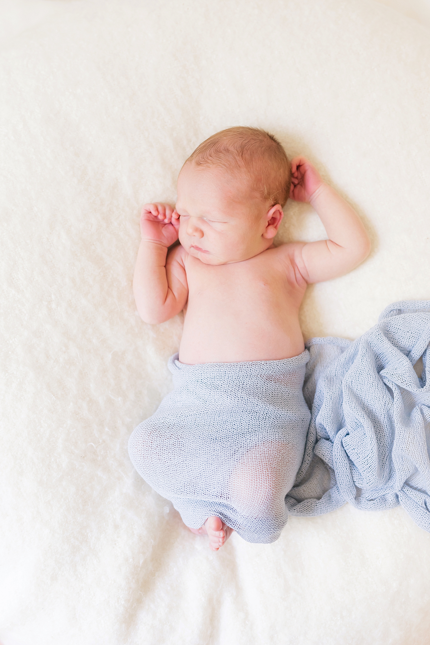 Sleeping newborn in light blue swaddle | Photo by Denver NC Newborn Photographer Anna Wisjo Photography