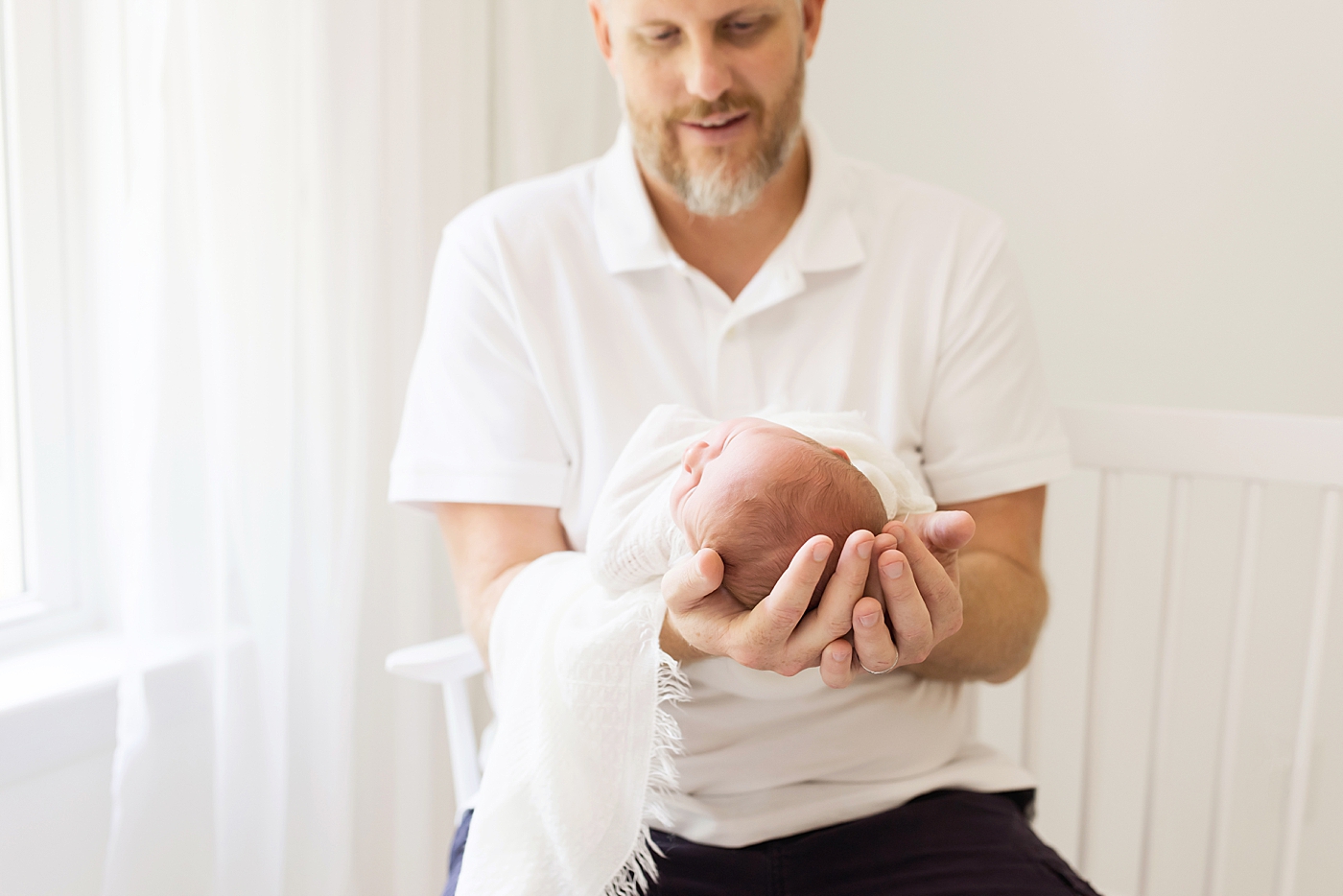 Dad holding newborn baby boy | Photo by Anna Wisjo Photography 