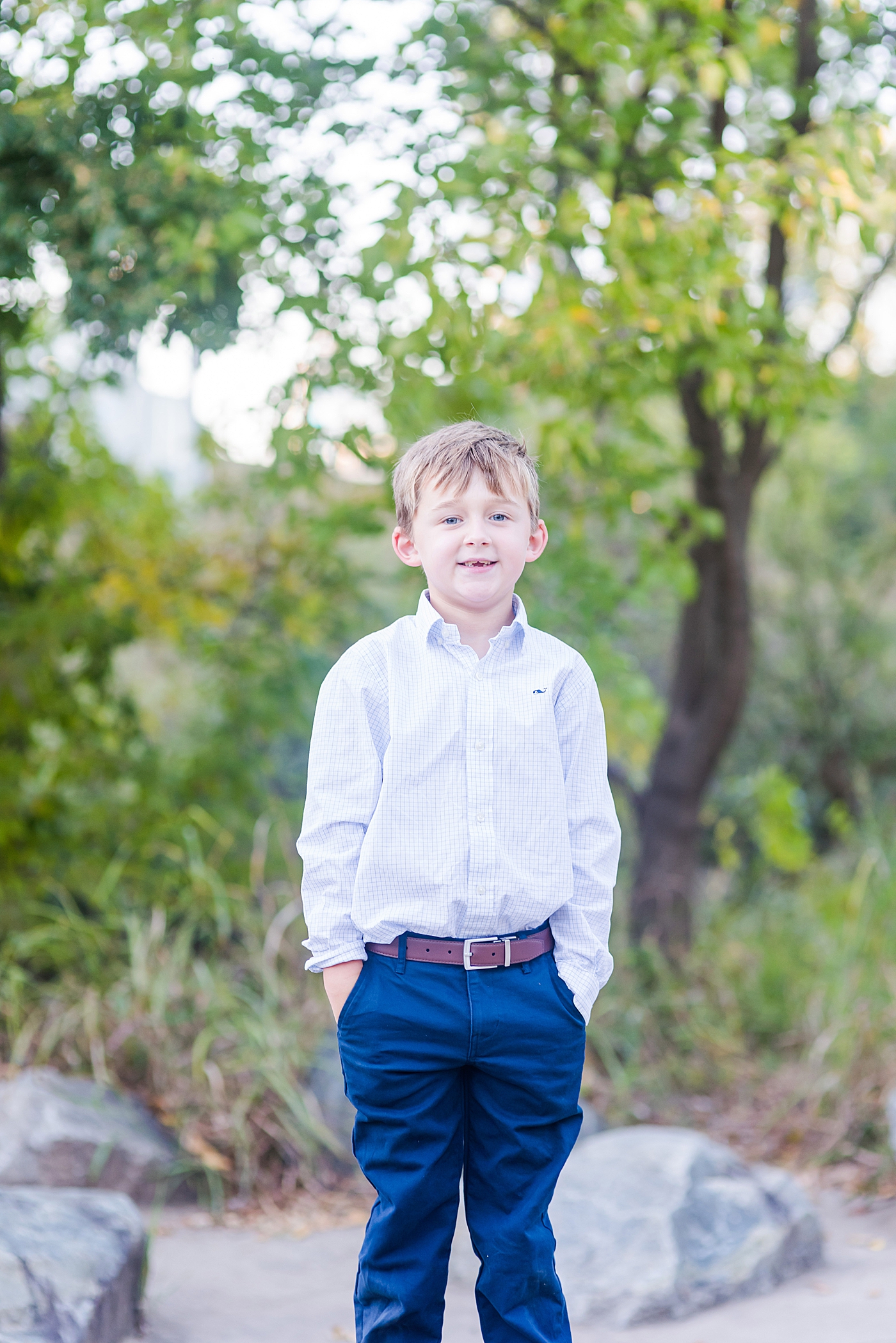Little boy in button down and blue pants | Photo by Anna Wisjo Photography