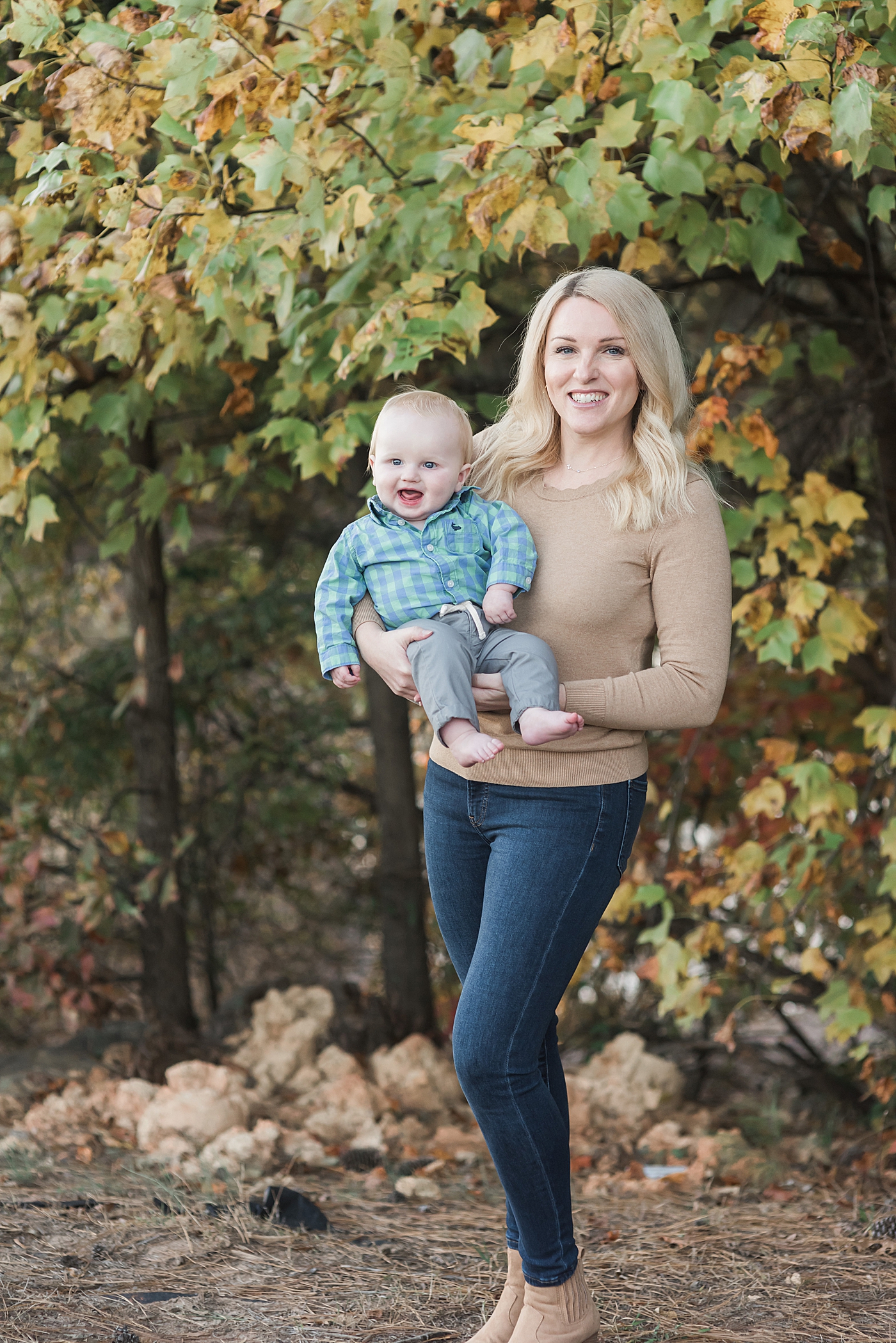 Mom holding her baby boy in blue top | Photo by Denver NC Milestone Photographer Anna Wisjo 