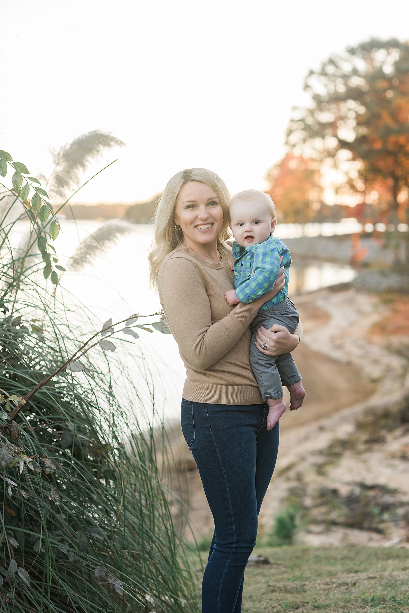 Mom smiling with baby boy | Photo by Denver NC Milestone Photographer Anna Wisjo 