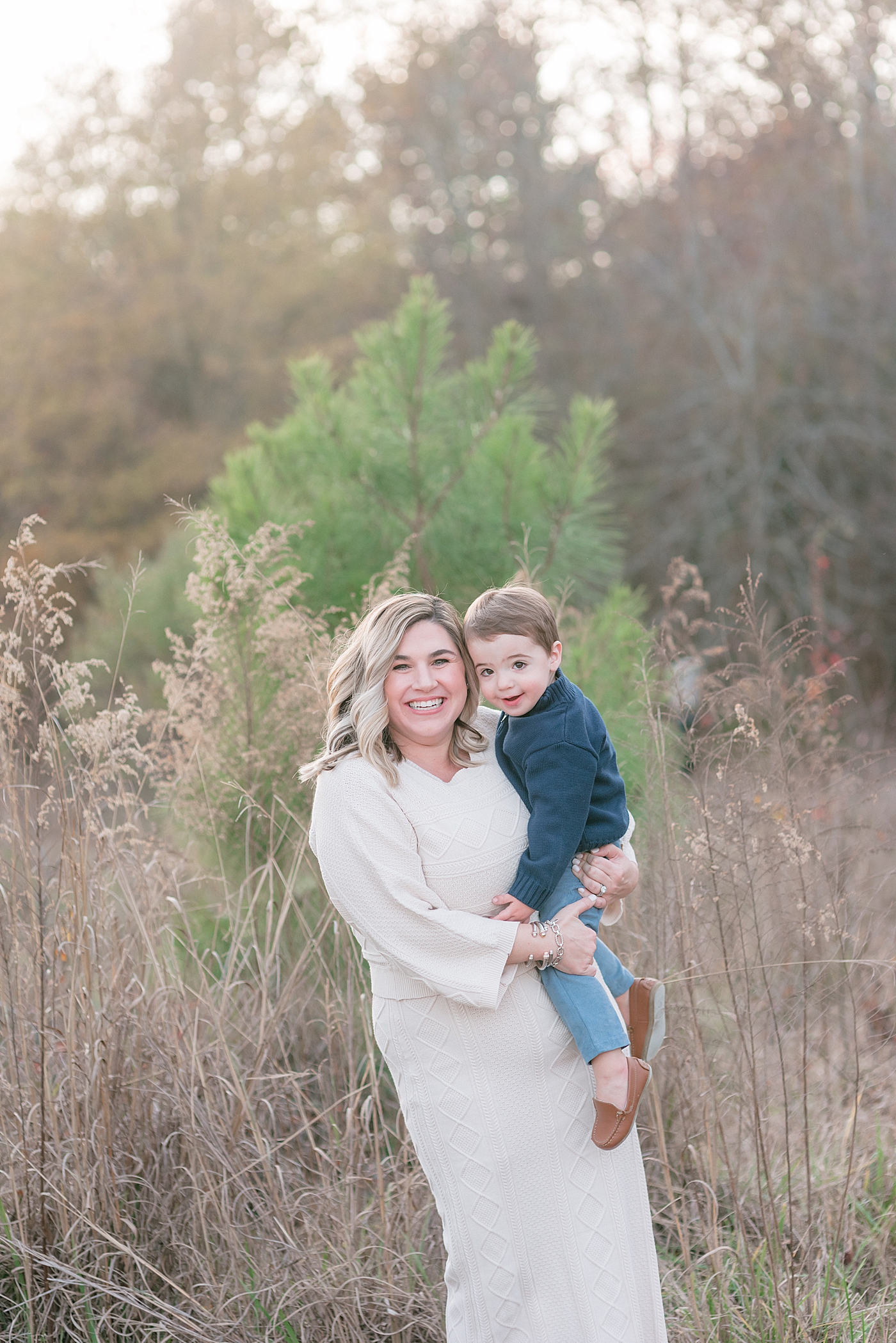 Mom and toddler boy smiling during Milestone Session at Marvin Efird Park | Photo by Anna Wisjo Photography 