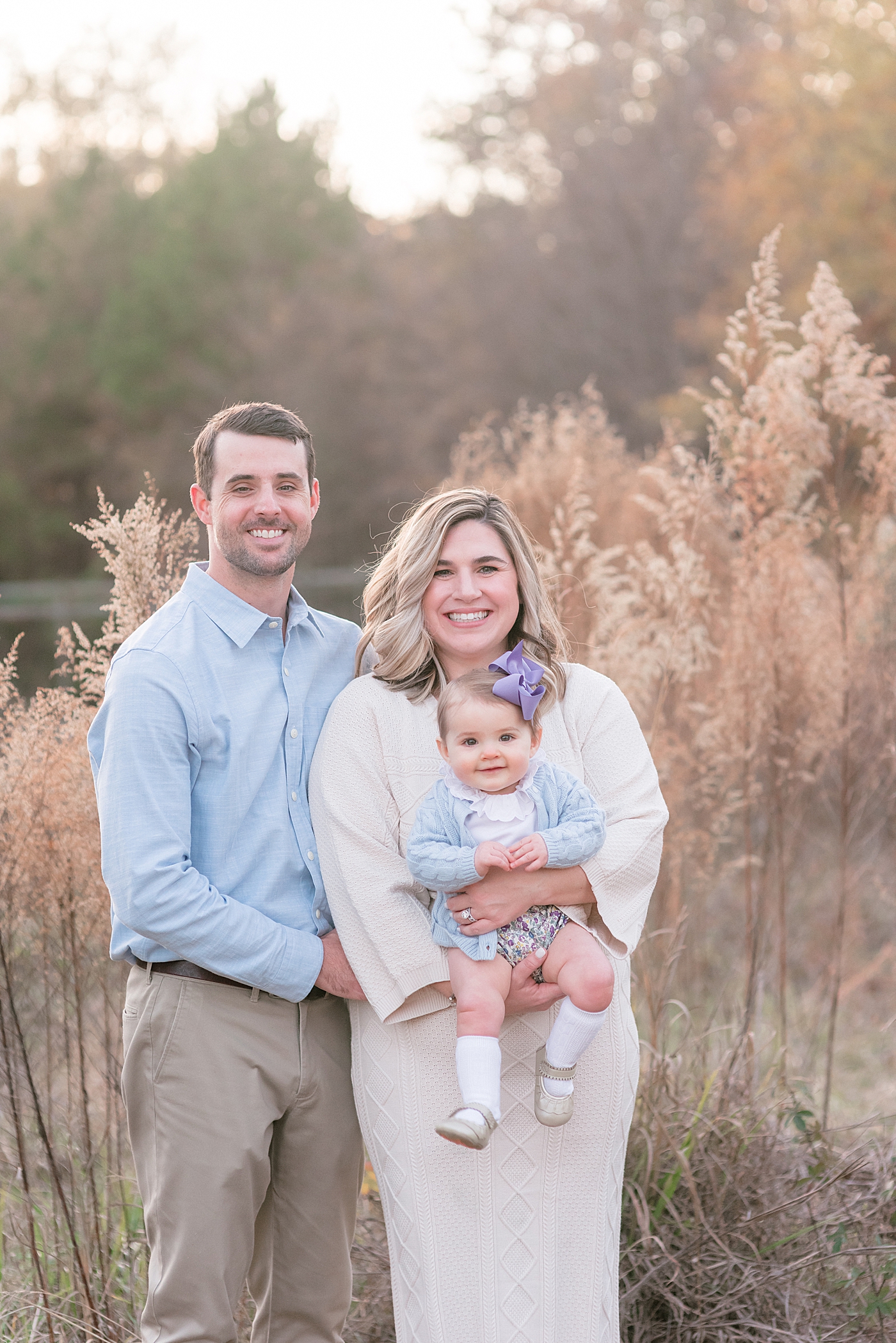 Mom and dad with their baby girl during her Milestone Session in Charlotte | Photo by Anna Wisjo Photography 