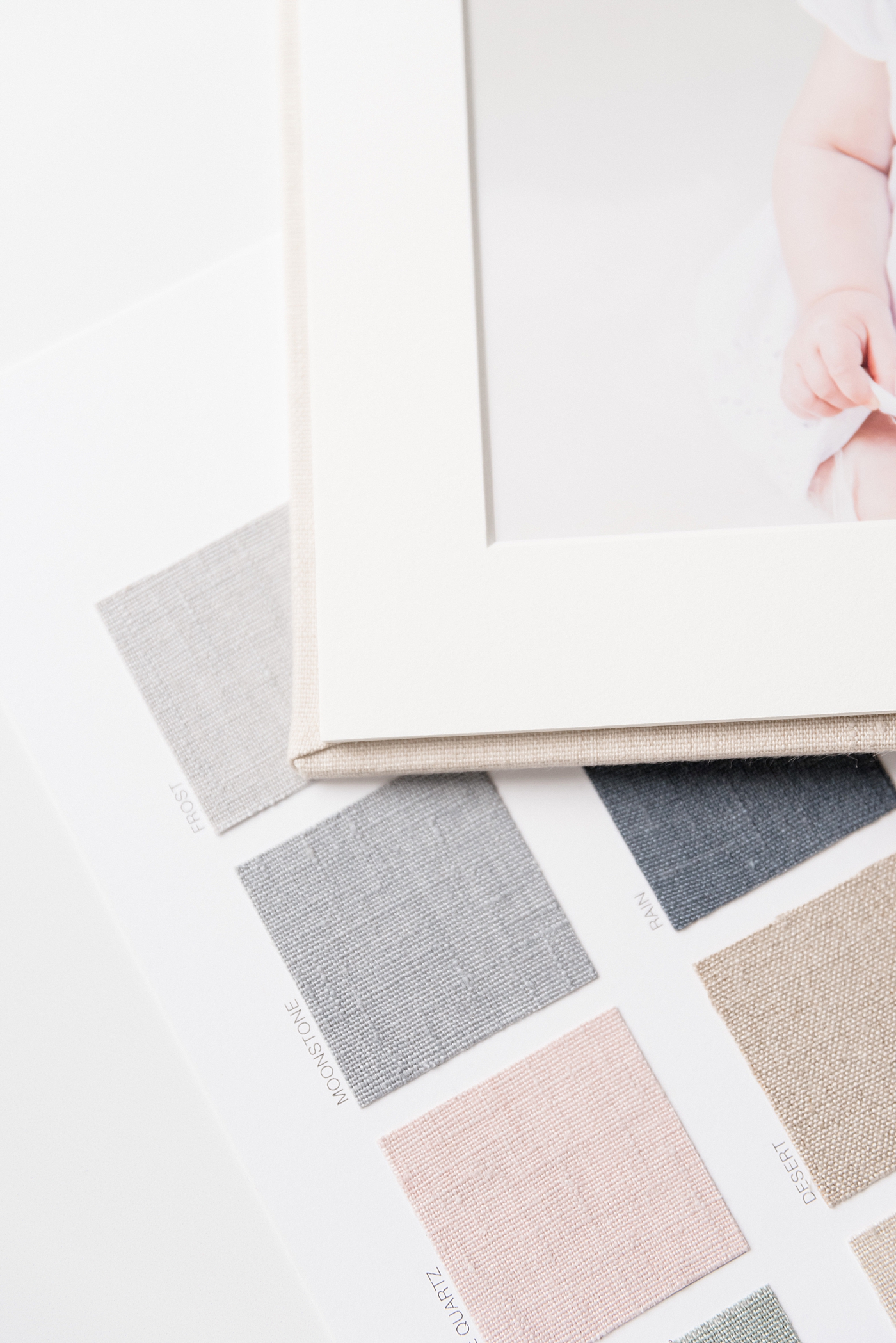 Detail of album pages with linen swatches | Photo by Anna Wisjo Photography