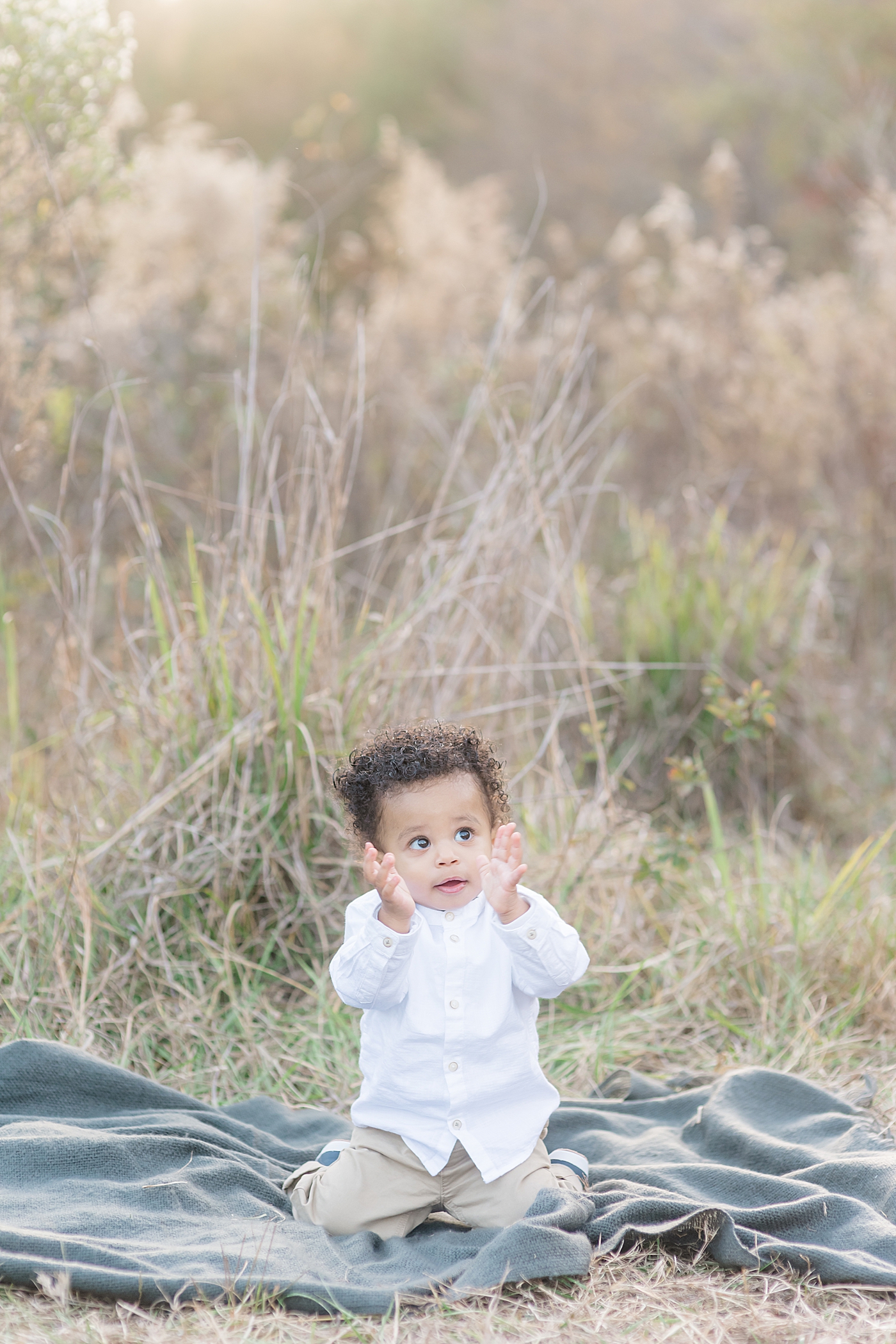 Baby boy clapping his hands | Photo by Anna Wisjo Photography