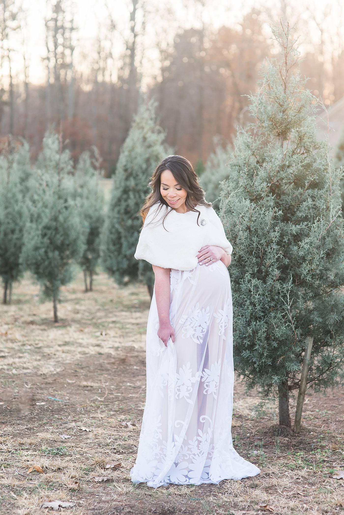 Mom to be in at a tree farm | Photo by Anna Wisjo Photography