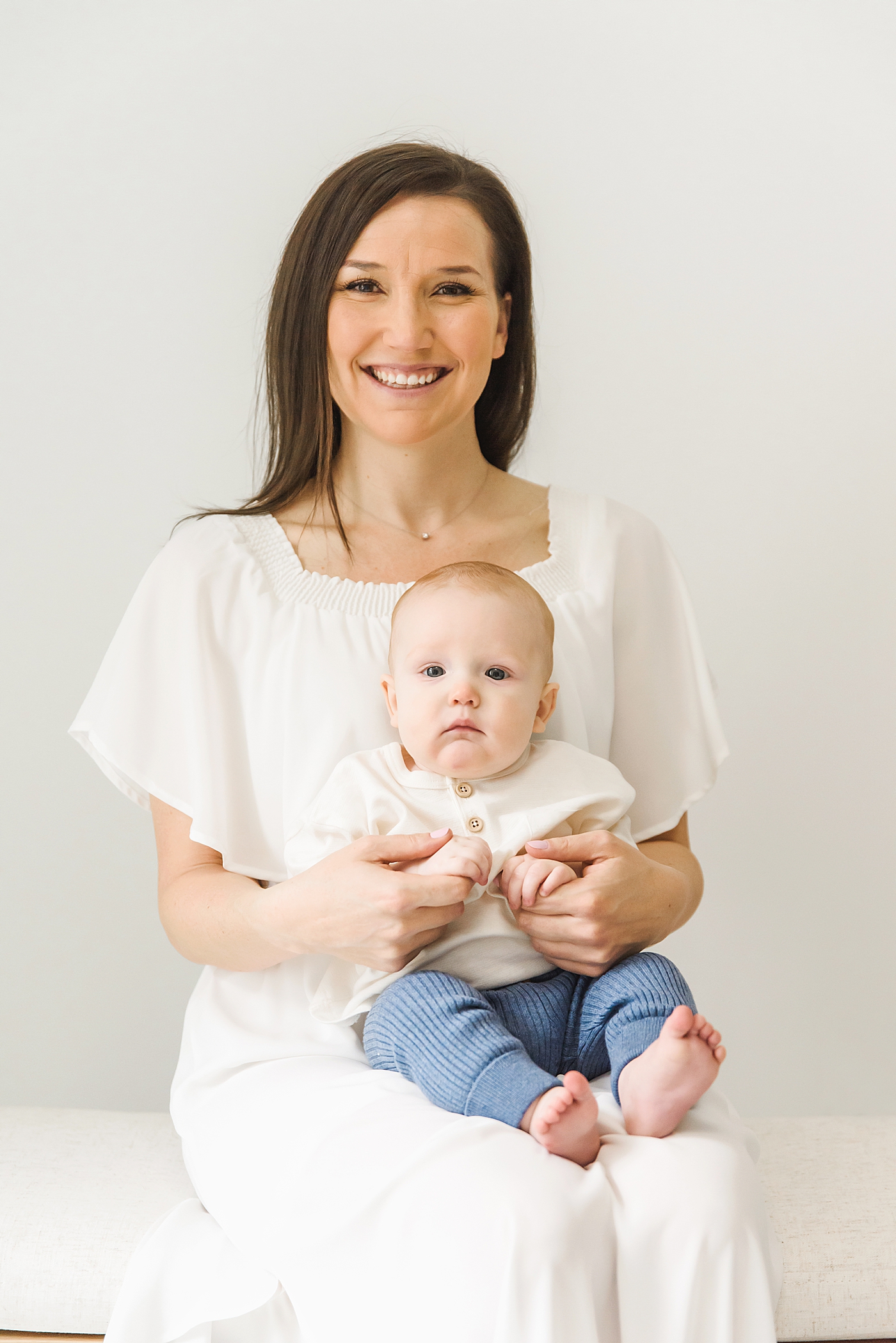 Mom holding her baby boy in the studio | Photo by Denver NC milestone photographer Anna Wisjo