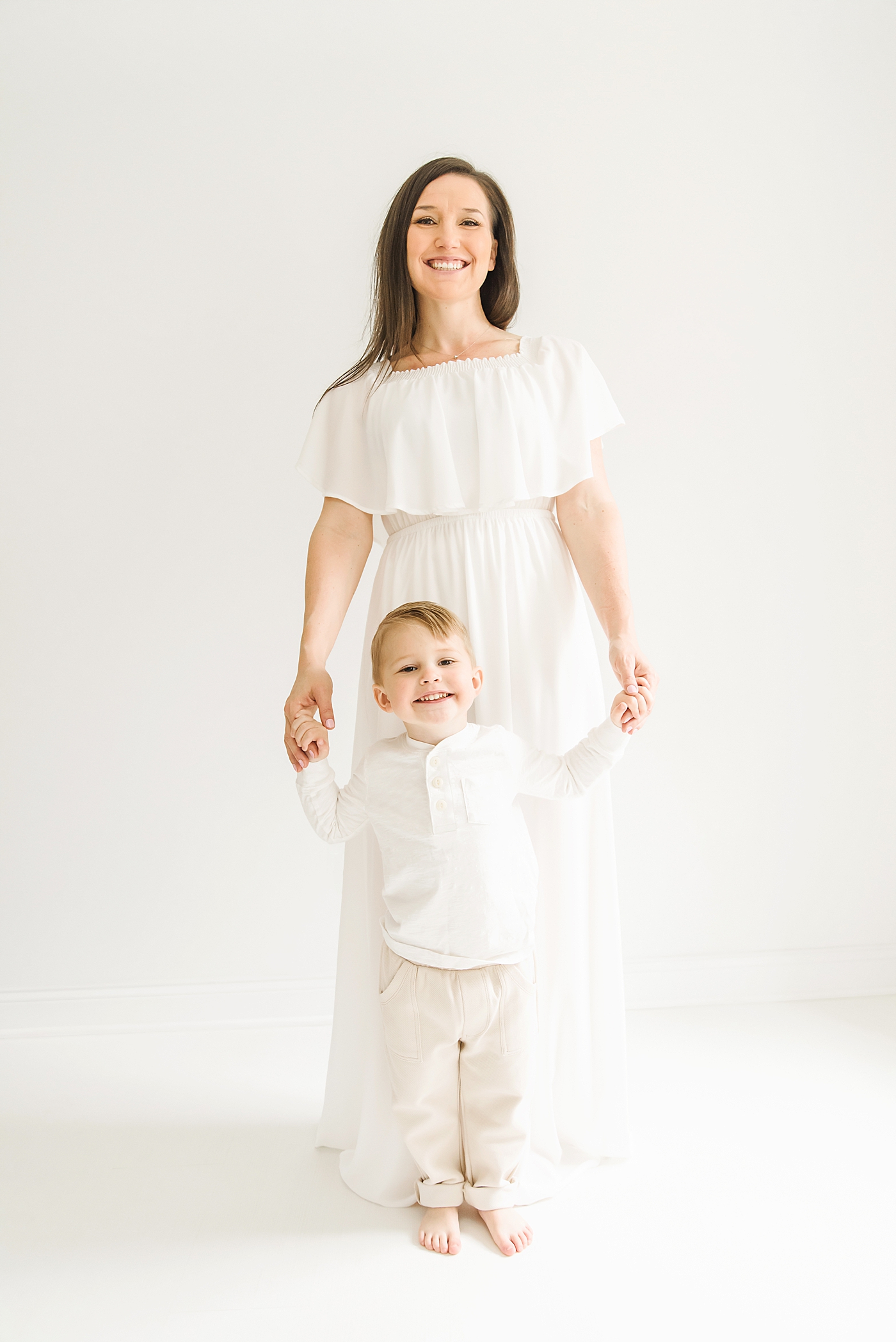 Mom and little boy in white | Photo by Denver NC milestone photographer Anna Wisjo